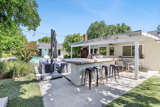 8683 N Colfax Ave, Fresno, CA 93720 - view of patio / terrace with ceiling fan, outdoor dry bar, and a pool