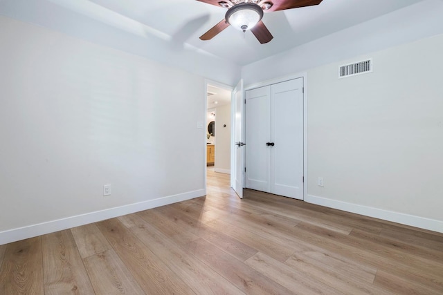 8683 N Colfax Ave, Fresno, CA 93720 - unfurnished bedroom with baseboards, a closet, light wood-style flooring, and visible vents