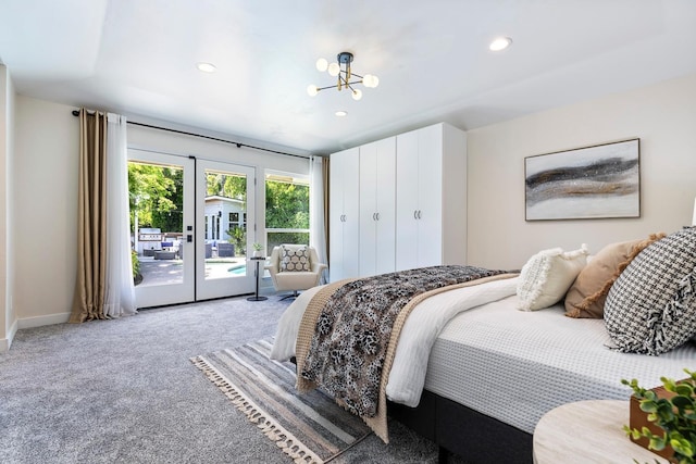8683 N Colfax Ave, Fresno, CA 93720 - carpeted bedroom featuring an inviting chandelier, access to outside, french doors, and recessed lighting