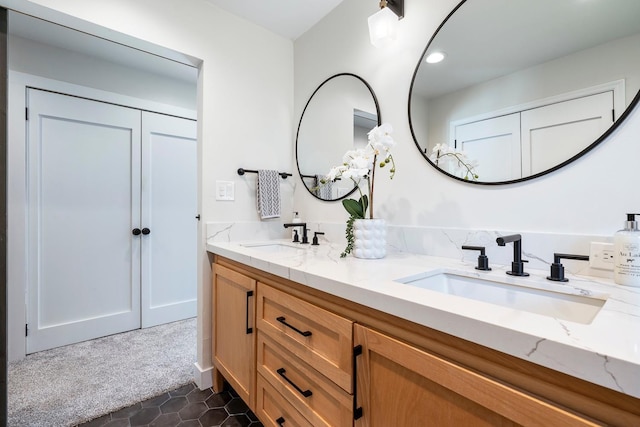 8683 N Colfax Ave, Fresno, CA 93720 - bathroom with double vanity, tile patterned floors, recessed lighting, and a sink