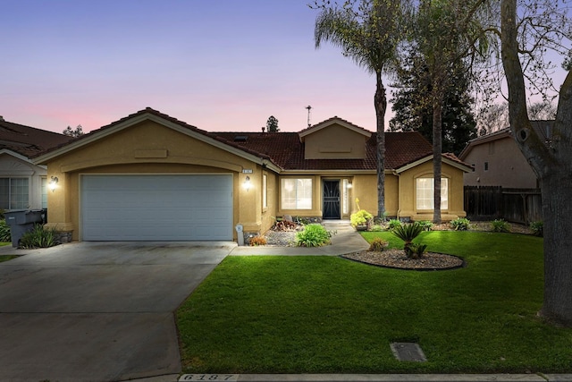 6187 W Alluvial Ave, Fresno, CA 93722 - ranch-style house featuring stucco siding, a tile roof, concrete driveway, and an attached garage