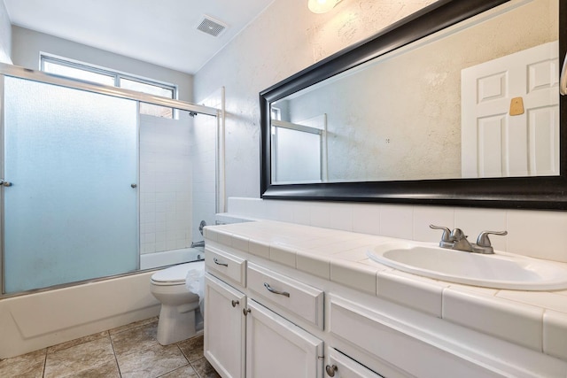 6187 W Alluvial Ave, Fresno, CA 93722 - bathroom with vanity and combined bath / shower with glass door