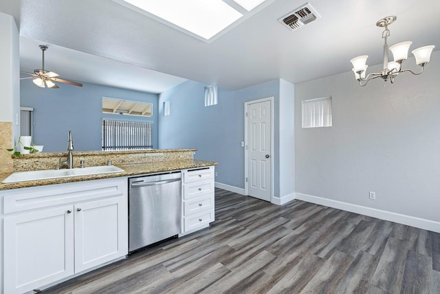 6187 W Alluvial Ave, Fresno, CA 93722 - kitchen with stainless steel dishwasher, dark wood finished floors, white cabinetry, a peninsula, and ceiling fan