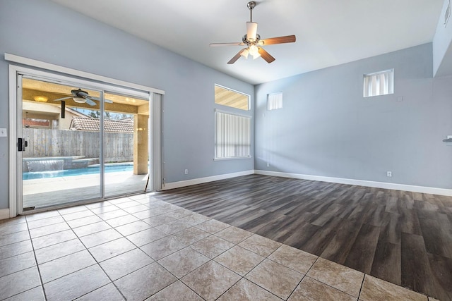 6187 W Alluvial Ave, Fresno, CA 93722 - empty room with ceiling fan, wood finished floors, and healthy amount of natural light