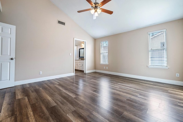 6187 W Alluvial Ave, Fresno, CA 93722 - unfurnished bedroom featuring high vaulted ceiling, dark wood-type flooring, ensuite bath, and a ceiling fan