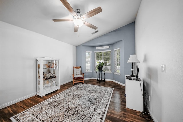 sitting room with vaulted ceiling, wood finished floors, a ceiling fan, and baseboards
