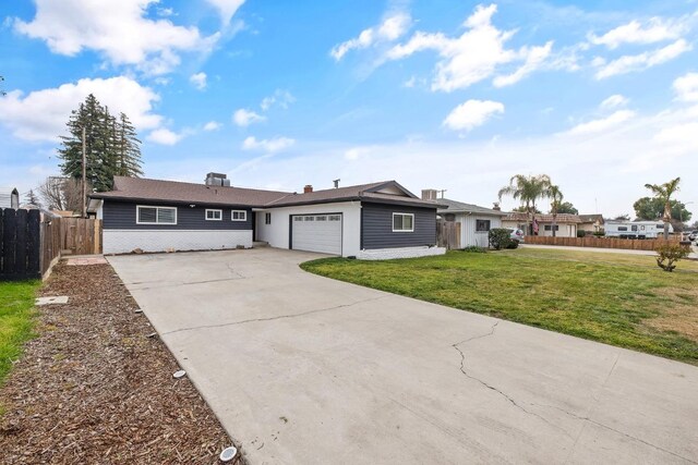single story home featuring a garage, driveway, fence, and a front lawn
