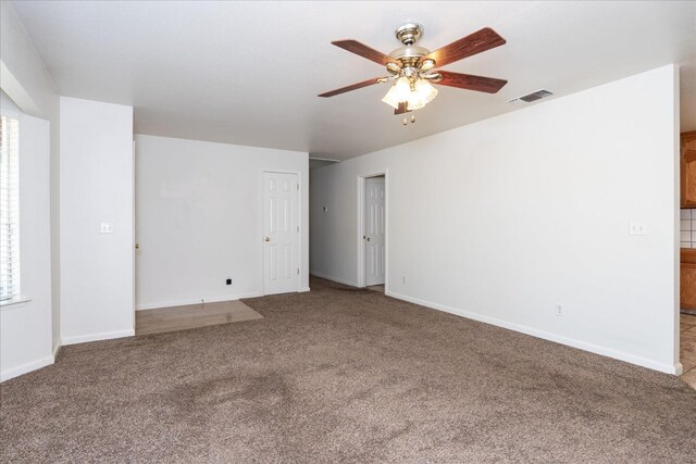 31200 Revis Rd, Coarsegold, CA 93614 - spare room featuring baseboards, a ceiling fan, and carpet
