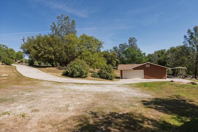 31200 Revis Rd, Coarsegold, CA 93614 - view of yard featuring driveway and a garage