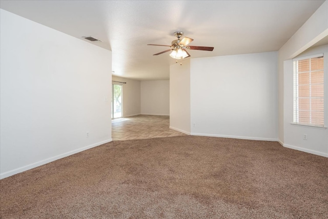 31200 Revis Rd, Coarsegold, CA 93614 - unfurnished room with light carpet, visible vents, baseboards, and a ceiling fan