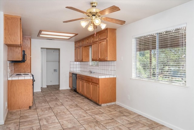 31200 Revis Rd, Coarsegold, CA 93614 - kitchen featuring ceiling fan, tile counters, backsplash, and dishwashing machine