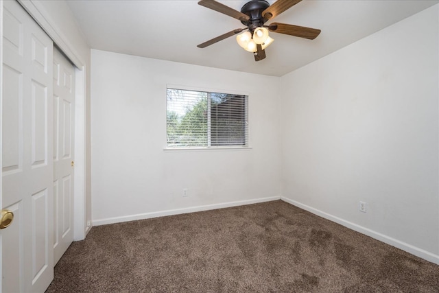 31200 Revis Rd, Coarsegold, CA 93614 - unfurnished bedroom with carpet flooring, a closet, baseboards, and ceiling fan