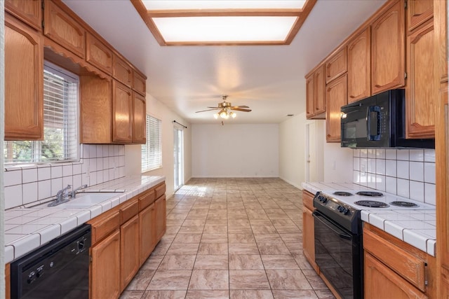31200 Revis Rd, Coarsegold, CA 93614 - kitchen with a sink, tasteful backsplash, black appliances, and tile countertops