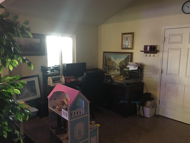tiled home office with vaulted ceiling