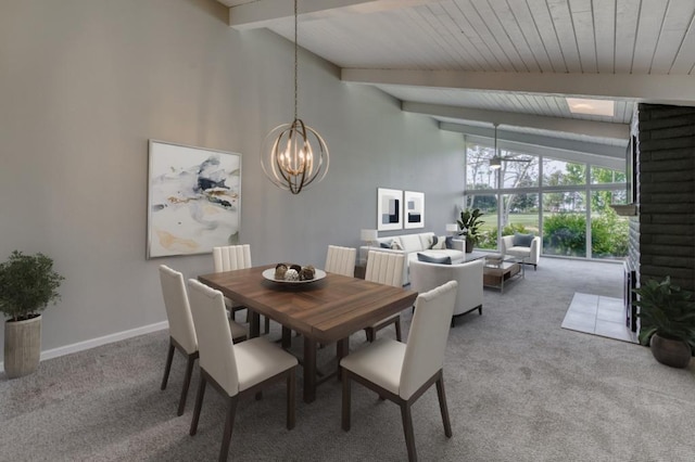 7560 N Charles Ave Unit C, Fresno, CA 93711 - carpeted dining area with baseboards, lofted ceiling with beams, and an inviting chandelier