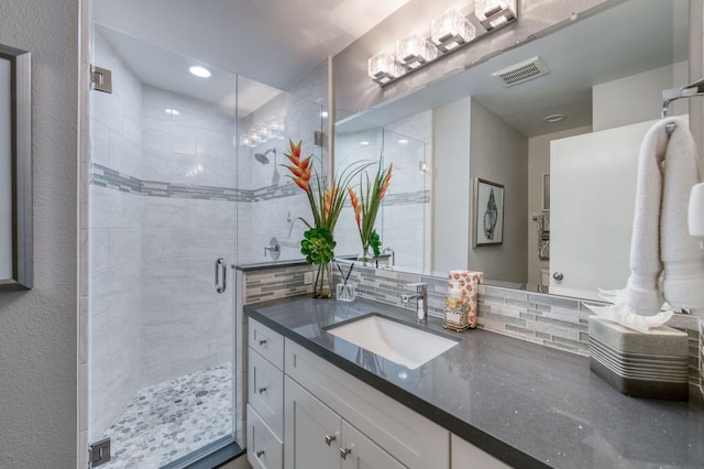 7560 N Charles Ave Unit C, Fresno, CA 93711 - full bath featuring vanity, recessed lighting, a shower stall, tasteful backsplash, and visible vents