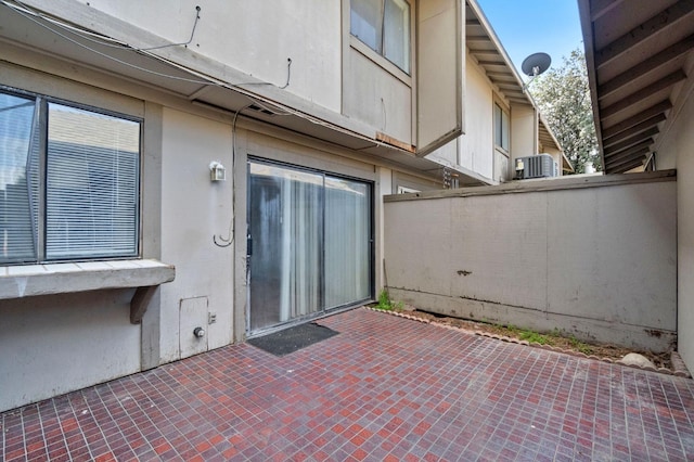 view of patio / terrace with fence and central AC
