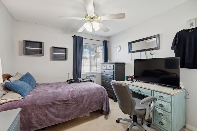 bedroom featuring a ceiling fan and light colored carpet