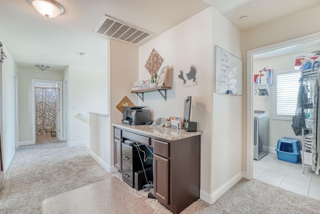 2960 3rd St, Sanger, CA 93657 - hallway featuring light colored carpet, a desk, baseboards, and washer / clothes dryer