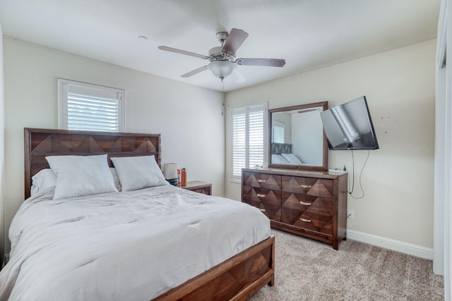 2960 3rd St, Sanger, CA 93657 - bedroom featuring multiple windows, light colored carpet, baseboards, and ceiling fan