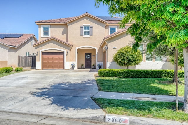 2960 3rd St, Sanger, CA 93657 - mediterranean / spanish-style house with a tile roof, stucco siding, roof mounted solar panels, and concrete driveway