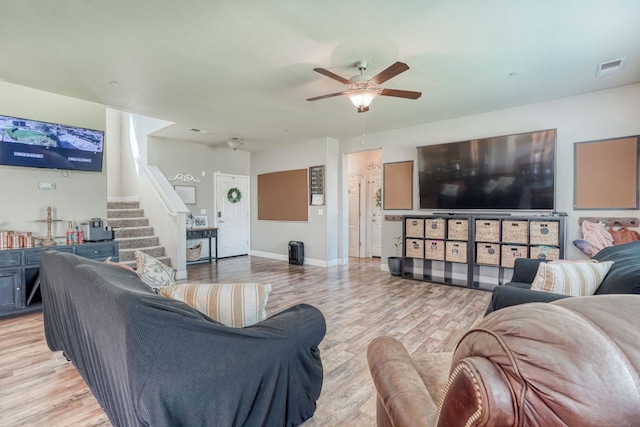 2960 3rd St, Sanger, CA 93657 - living room with stairway, ceiling fan, light wood-style flooring, and baseboards