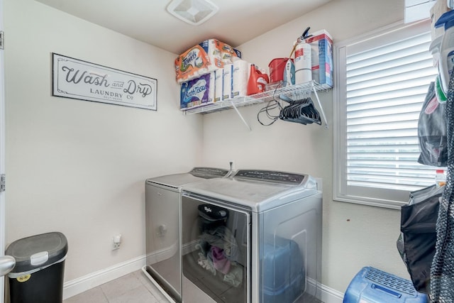 2960 3rd St, Sanger, CA 93657 - laundry room with washing machine and dryer, baseboards, and light tile patterned floors
