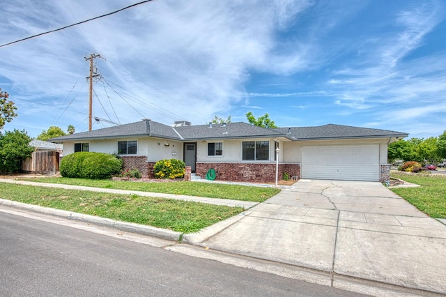 3907 E Dayton Ave, Fresno, CA 93726 - view of front of house with a garage, brick siding, driveway, and stucco siding