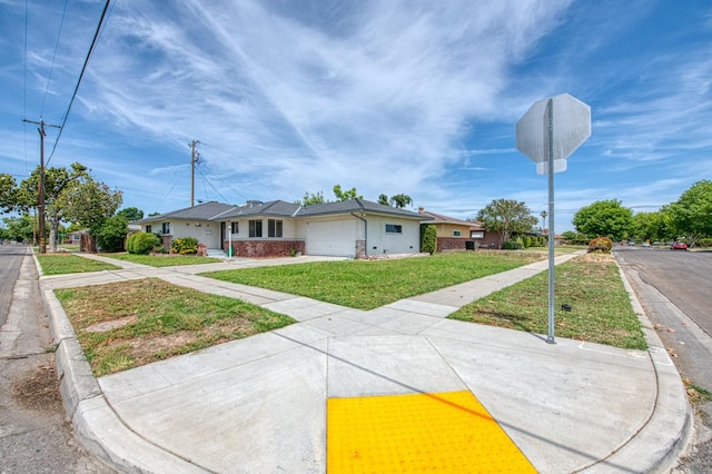 3907 E Dayton Ave, Fresno, CA 93726 - single story home with a front lawn, an attached garage, driveway, and stucco siding