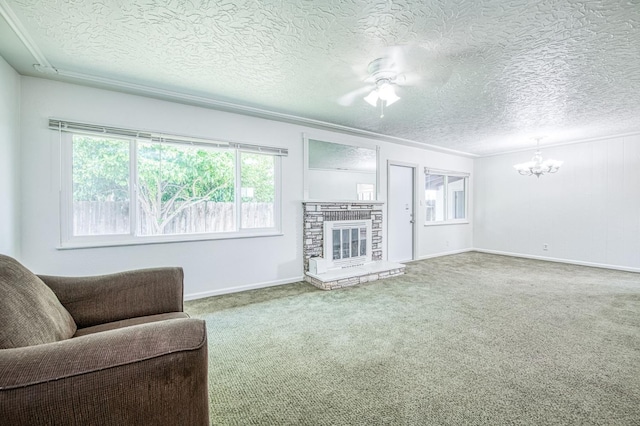 3907 E Dayton Ave, Fresno, CA 93726 - carpeted living area with a chandelier, healthy amount of natural light, a textured ceiling, baseboards, and a ceiling fan