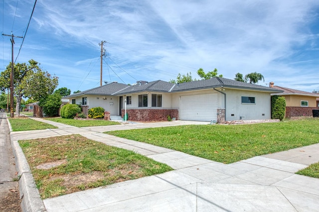 3907 E Dayton Ave, Fresno, CA 93726 - view of front facade with an attached garage, concrete driveway, a front lawn, stucco siding, and brick siding