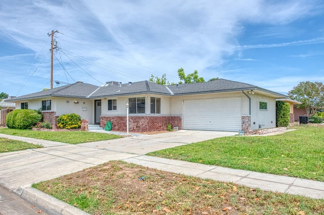 3907 E Dayton Ave, Fresno, CA 93726 - single story home featuring an attached garage, driveway, a front lawn, brick siding, and stucco siding
