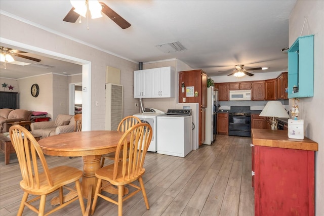 dining area featuring crown molding, ceiling fan, independent washer and dryer, visible vents, and light wood finished floors