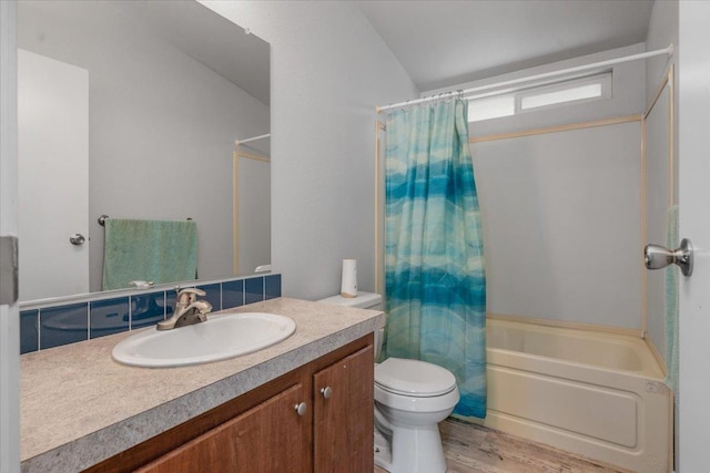 9202 E Herndon Ave, Clovis, CA 93619 - bathroom featuring wood finished floors, shower / bath combo, toilet, vanity, and lofted ceiling