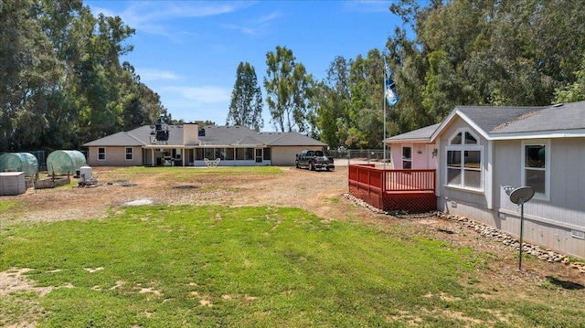 9202 E Herndon Ave, Clovis, CA 93619 - back of property featuring a wooden deck, a yard, and crawl space