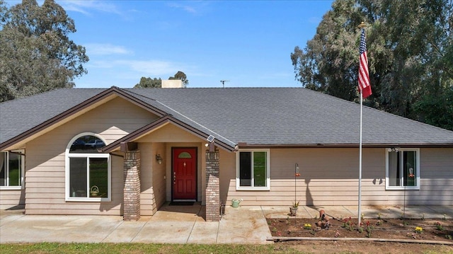 9202 E Herndon Ave, Clovis, CA 93619 - ranch-style house featuring a shingled roof and a chimney