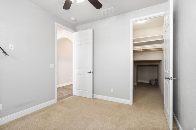 1905 E Via Fiore Ave, Fresno, CA 93730 - unfurnished bedroom with a closet, a ceiling fan, a spacious closet, visible vents, and carpet floors