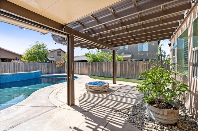 1905 E Via Fiore Ave, Fresno, CA 93730 - view of patio / terrace featuring a fenced in pool, a fire pit, a fenced backyard, and a pergola