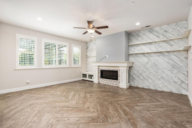 1905 E Via Fiore Ave, Fresno, CA 93730 - unfurnished living room with a glass covered fireplace, baseboards, recessed lighting, visible vents, and ceiling fan