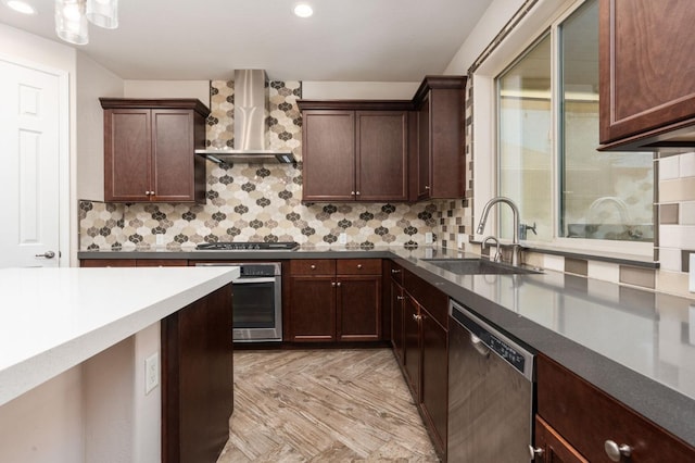 1905 E Via Fiore Ave, Fresno, CA 93730 - kitchen with a sink, wall chimney range hood, appliances with stainless steel finishes, recessed lighting, and decorative backsplash