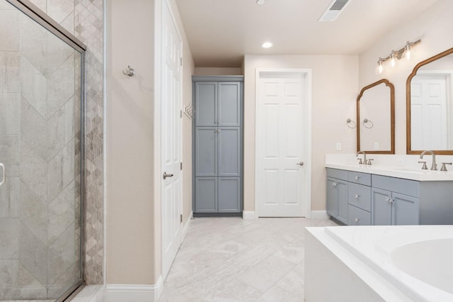1905 E Via Fiore Ave, Fresno, CA 93730 - full bath featuring a shower stall, visible vents, recessed lighting, a sink, and double vanity