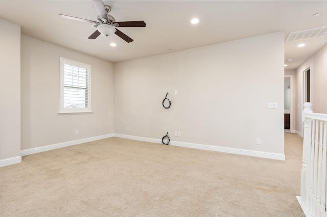 1905 E Via Fiore Ave, Fresno, CA 93730 - spare room featuring light colored carpet, a ceiling fan, visible vents, and recessed lighting