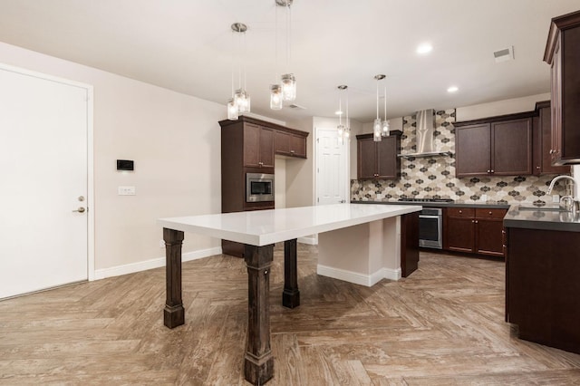 1905 E Via Fiore Ave, Fresno, CA 93730 - kitchen featuring wall chimney exhaust hood, a sink, dark brown cabinets, stainless steel appliances, and a kitchen island