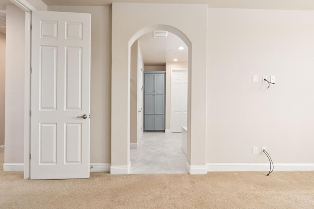 1905 E Via Fiore Ave, Fresno, CA 93730 - interior space featuring light carpet, arched walkways, baseboards, and recessed lighting