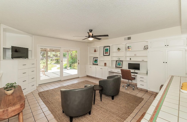 9798 S Thompson, Selma, CA 93662 - office area featuring a ceiling fan, built in study area, light tile patterned floors, and a textured ceiling