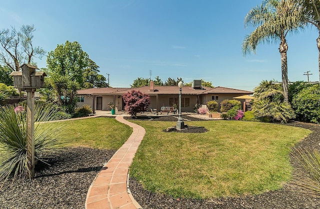 9798 S Thompson, Selma, CA 93662 - rear view of house with a yard and stucco siding