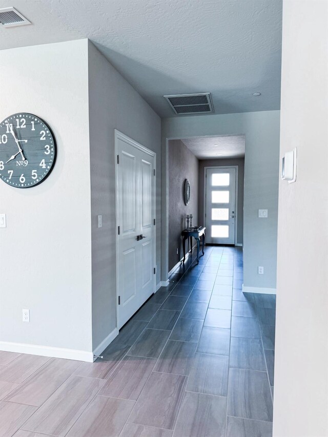 3395 Las Rosas Ave, Clovis, CA 93619 - entrance foyer with baseboards and a textured ceiling