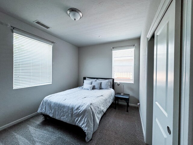 3395 Las Rosas Ave, Clovis, CA 93619 - carpeted bedroom with baseboards and a textured ceiling