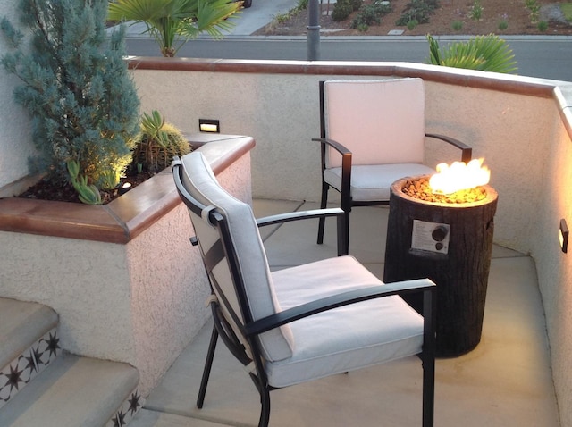 balcony with an outdoor fire pit