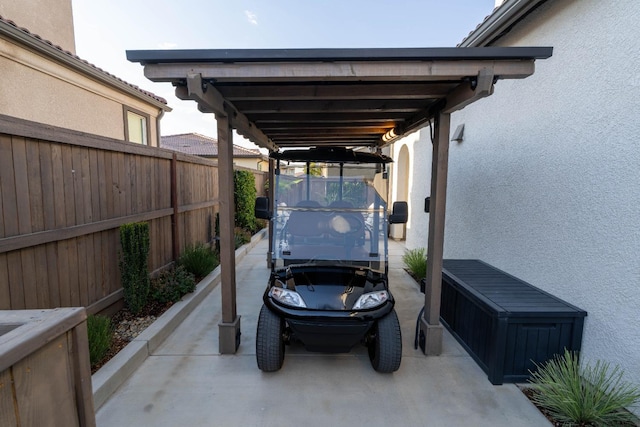 view of parking with fence